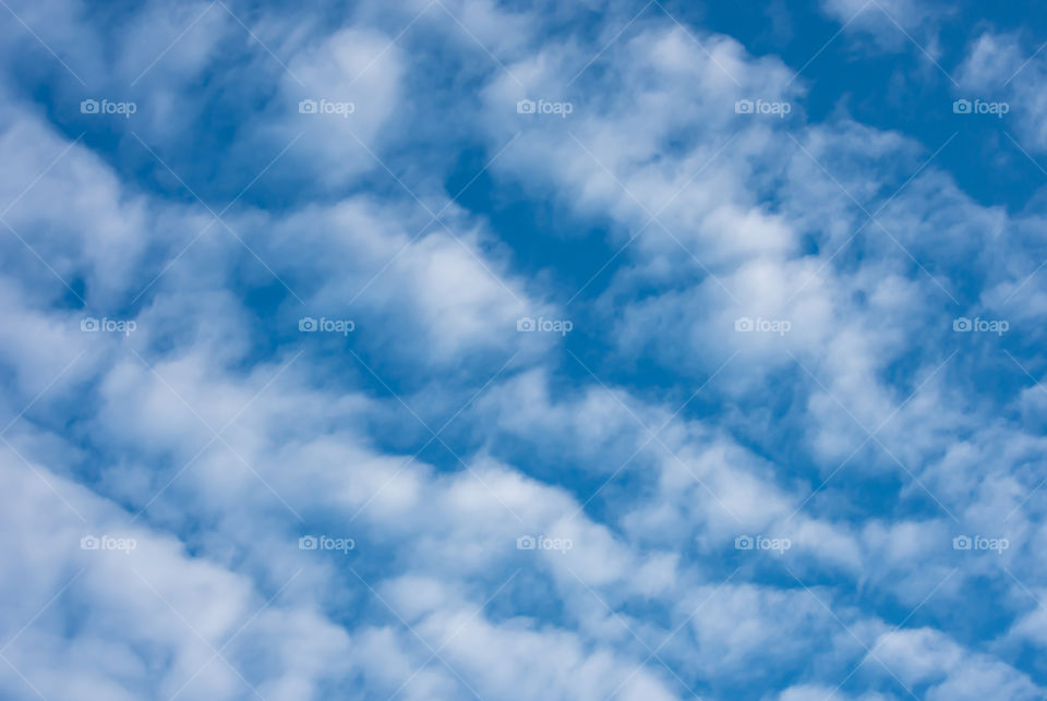 The beauty of the sky with clouds and the sun.