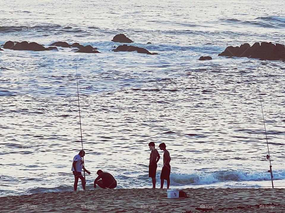 Fishing by the sea