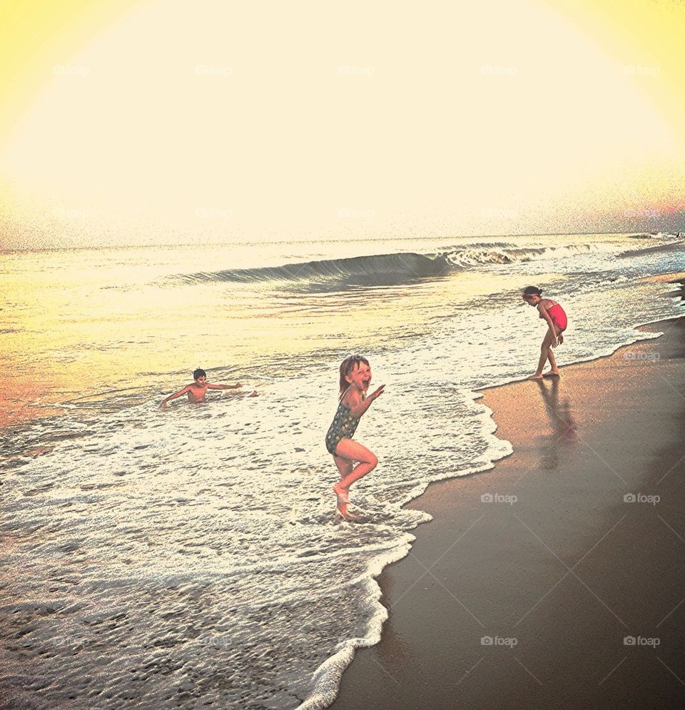 Kids having fun in the ocean