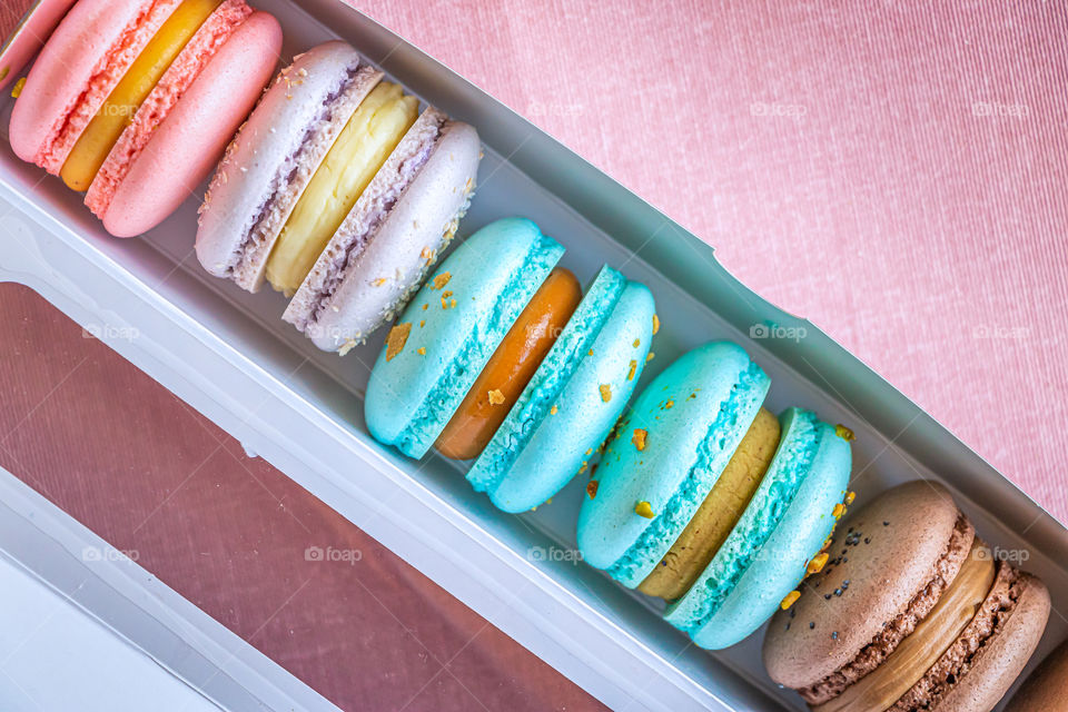 Box with macarons filled of cream.