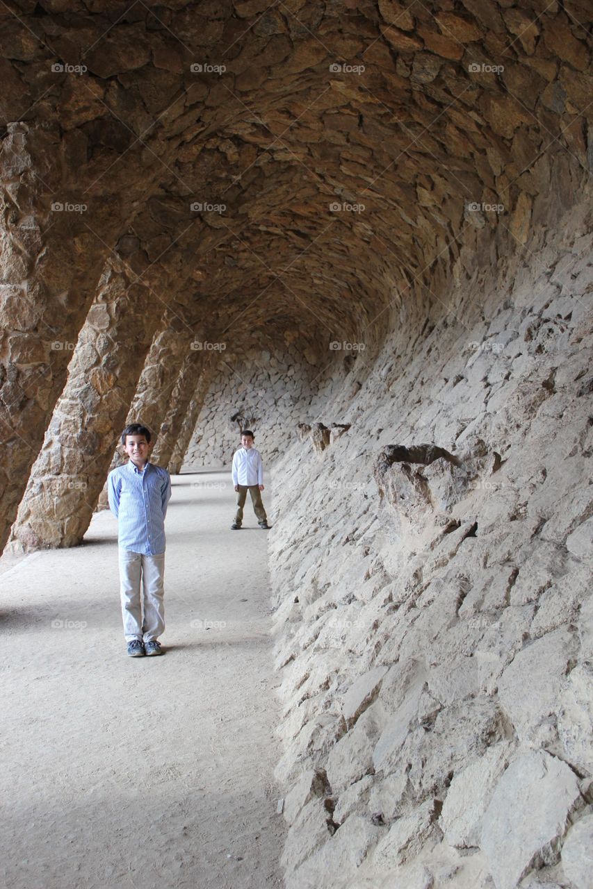 Boys/ kids playing at Park Guell Barcelona Spain. International travel with kids. Outdoor activities.