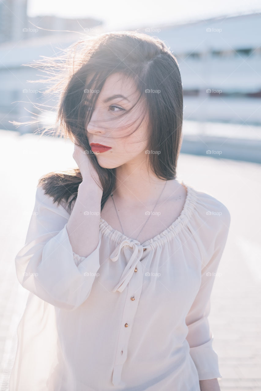 Close-up of a woman with red lipstick