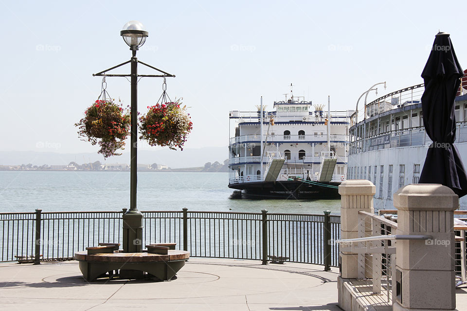 Pier, boat, flowers 