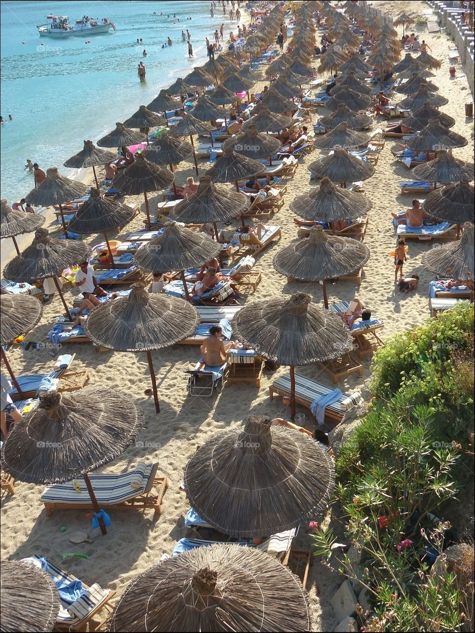 Crowded beach in Mykonos island, Greece