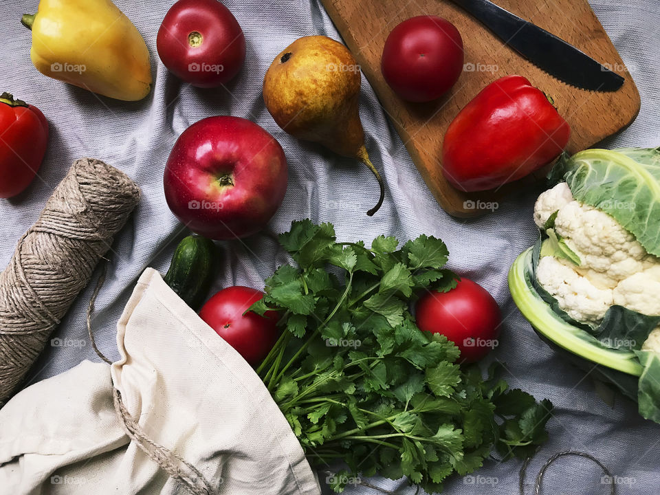 Overheard view of a healthy food - fresh fruits, greenery and vegetables 