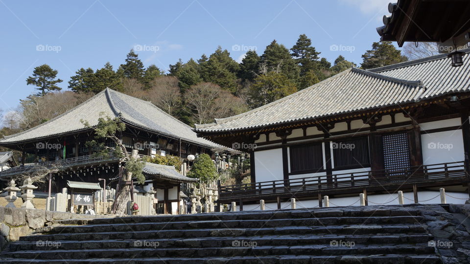 nigatsu-do hall in Nara, Japan. Tons of lanterns and decorative stones surrounded everything.