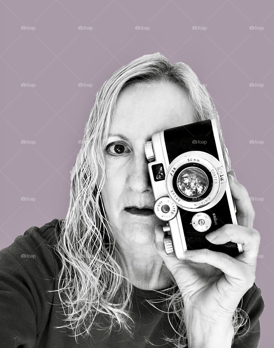 Woman with camera in black and white