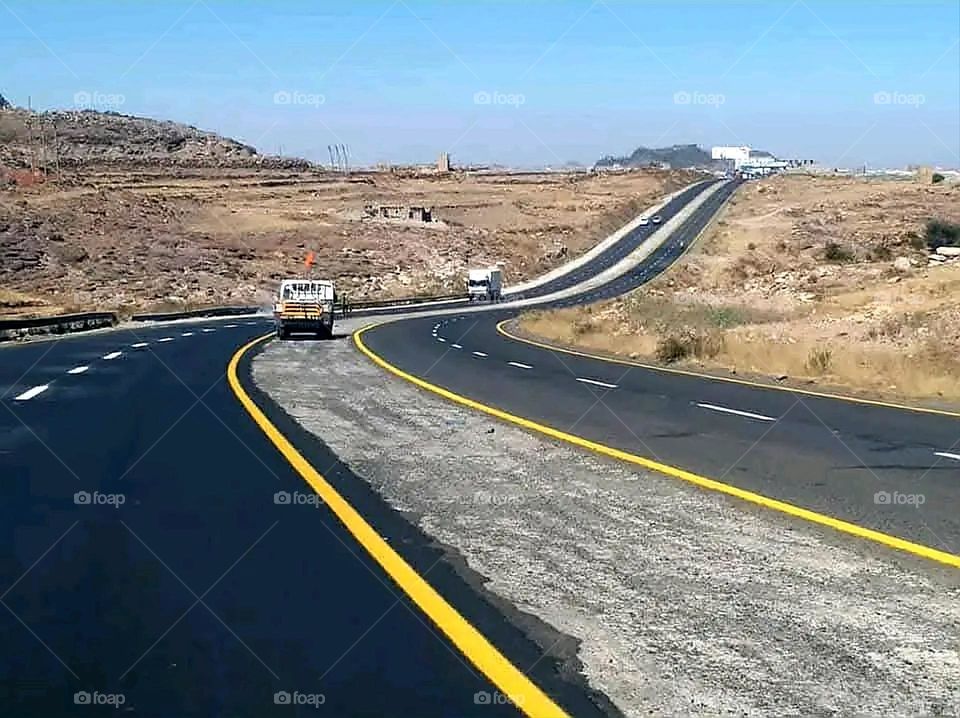 A stunning view of green mountains covered in fog in Yemen