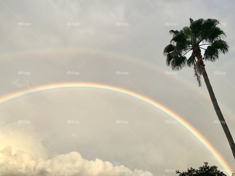 Rainy day happiness with colorful rainbow 
