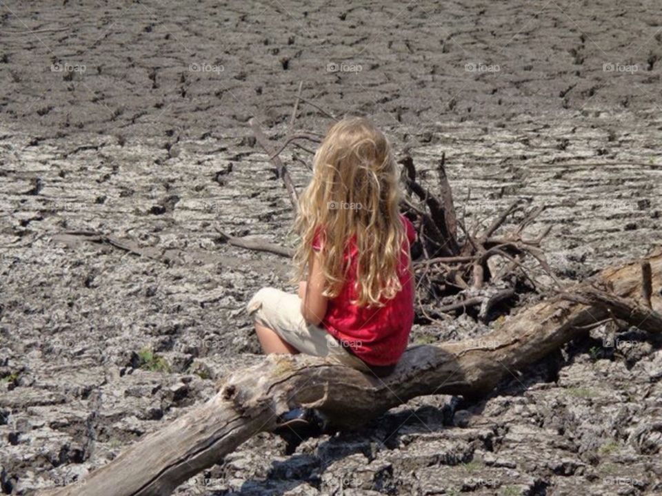 Summer Drought. My daughter walking along where the river should be flowing.  