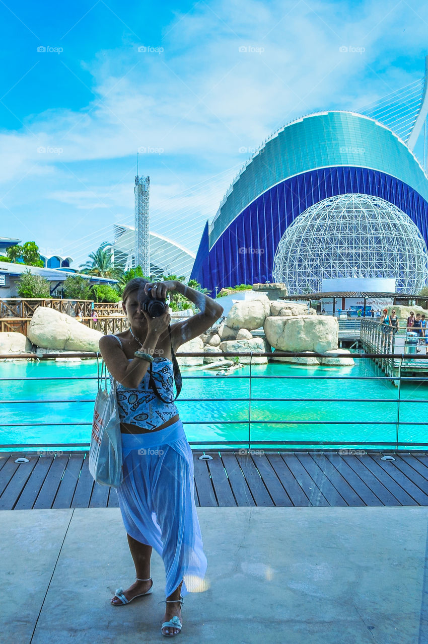 Girl making selfie in oceanographic museum in Valencia 