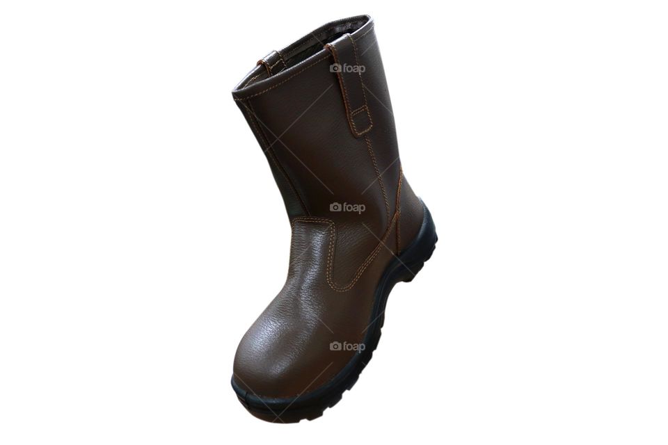 Photo of brown boots on a white background