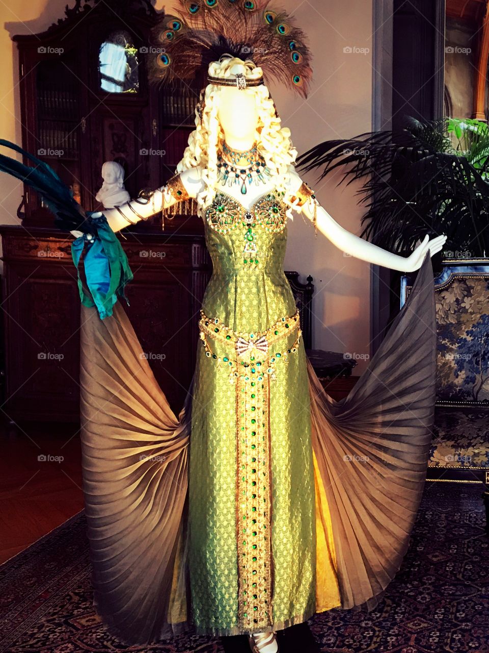 Mannequin wearing peacock inspired gown