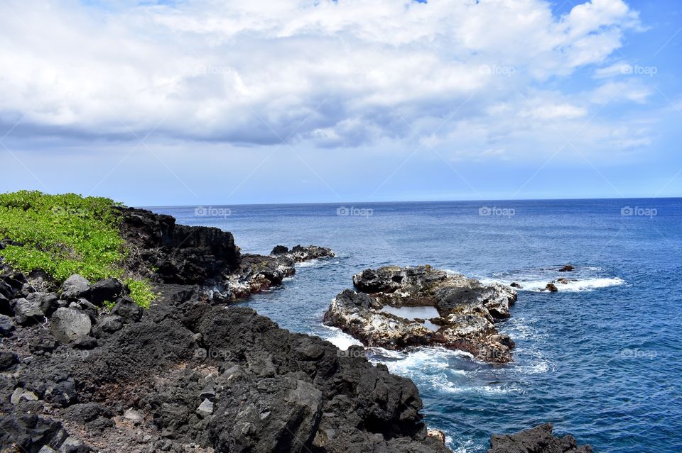 Along the beautiful ocean sea cliffs of lava rock on the east side of the Big Island of Hawaii.