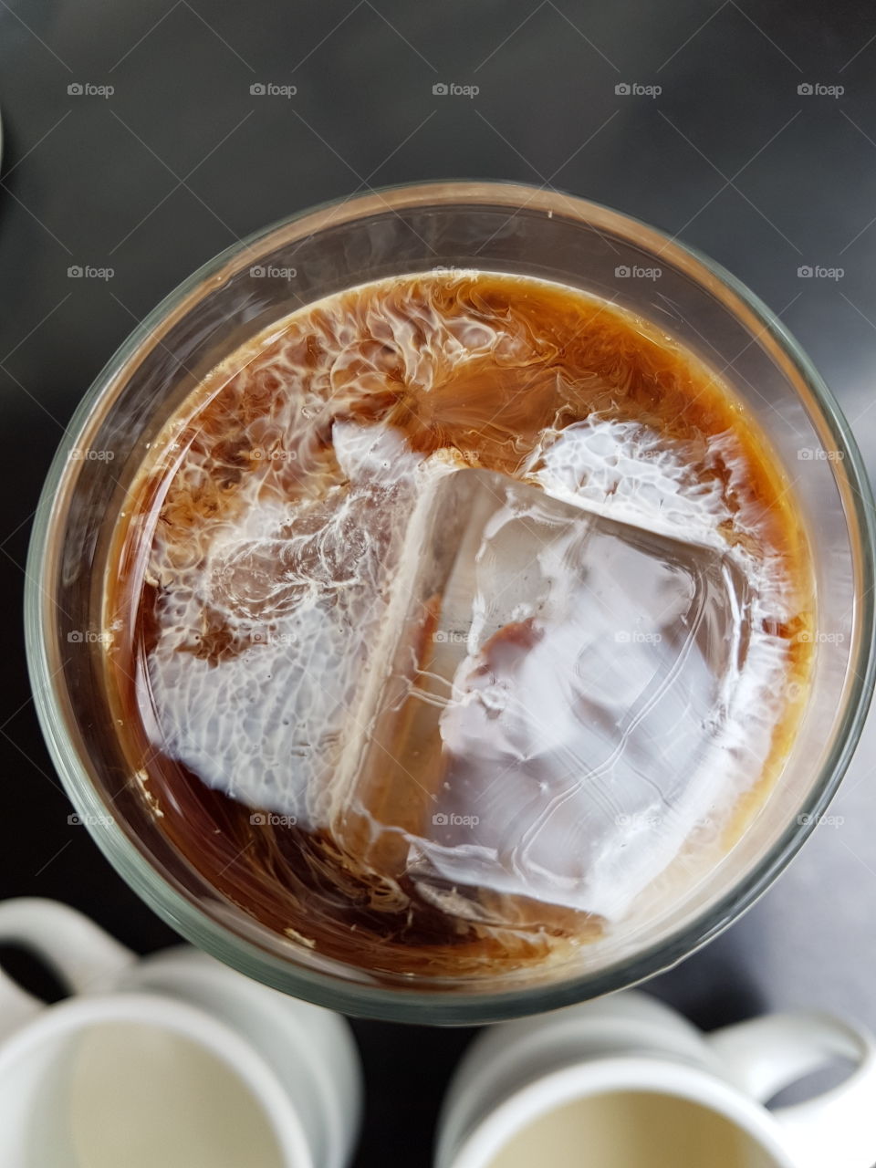 watching my morning coffee get milked over ice