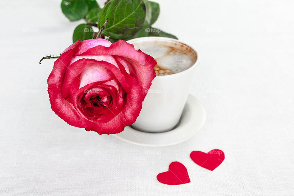 cup of coffee and a rose