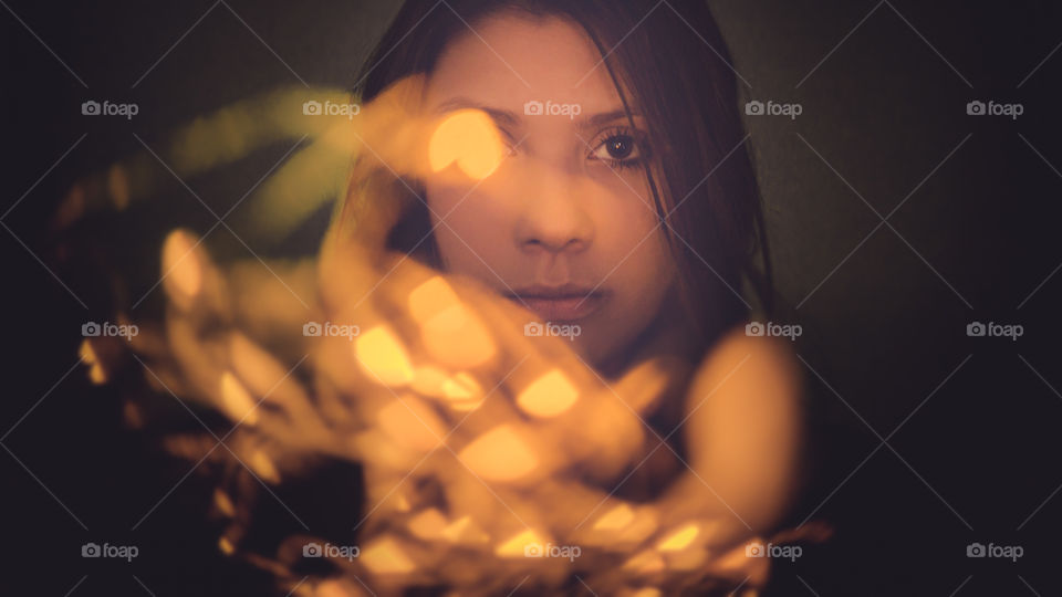 Woman holding light bulb in hand