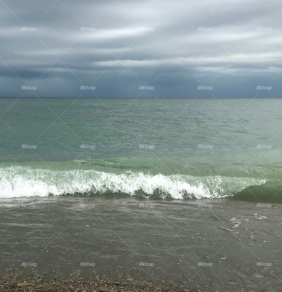 When the clouds darken on Lake Erie, most people head in a take cover. Not me. I like to head out to the beach and watch the storm rolling in.