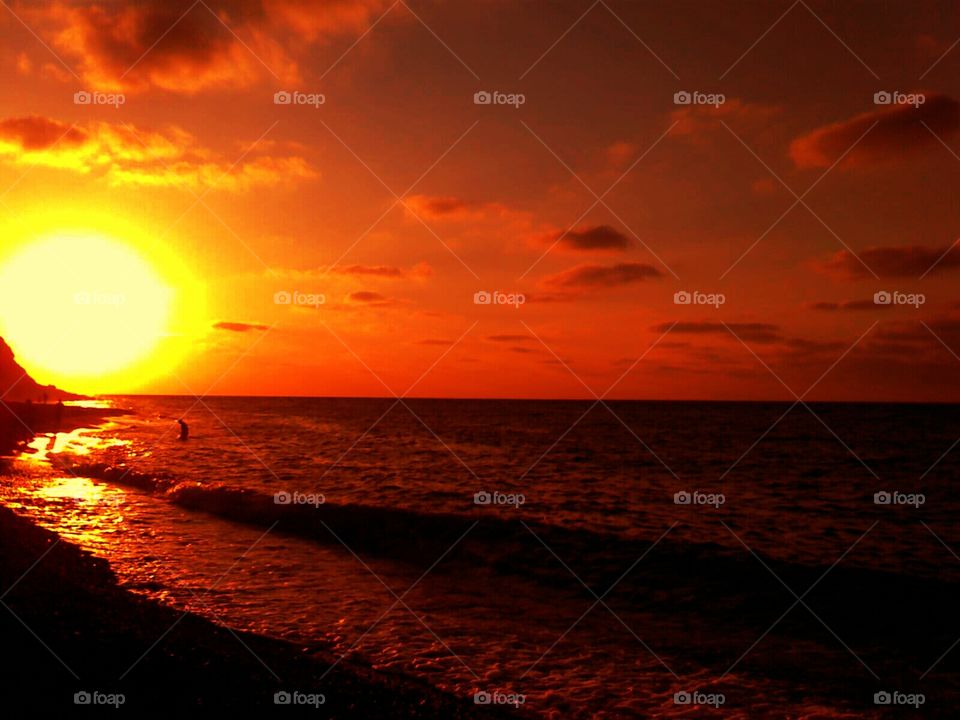 Sunset over Stromboli Island ( Italy ).