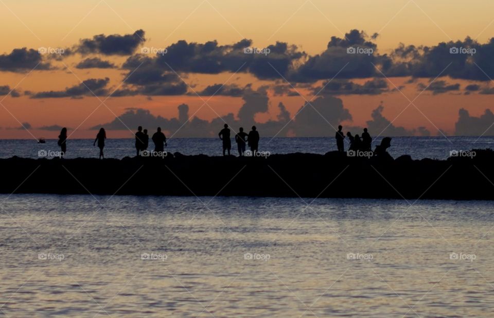 sunset people . watching the sunset at the pier