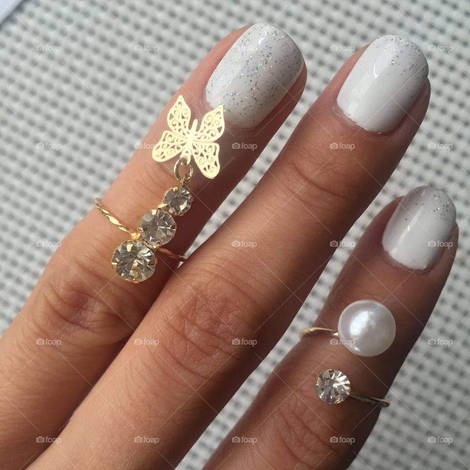 White manicure on nails covered with bliss