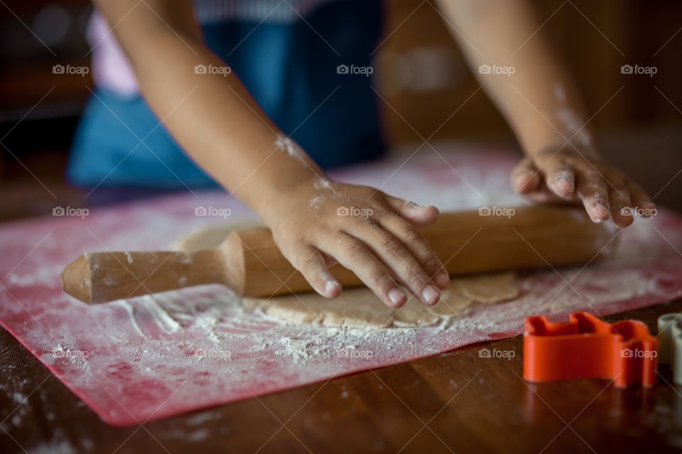 Little sisters cooking the biscuits 