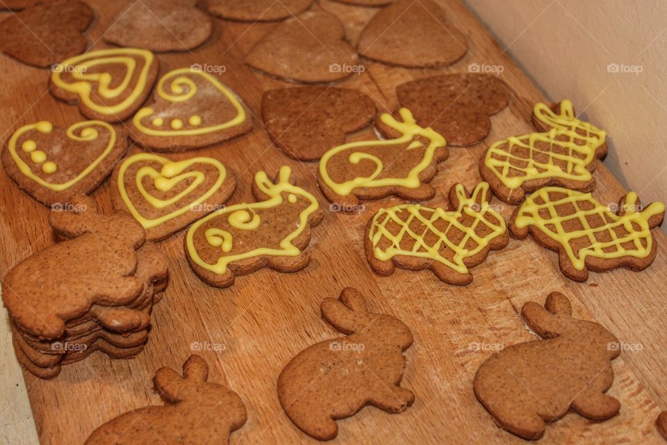 cookies yellow Easter gingerbread bunnies on a wooden background