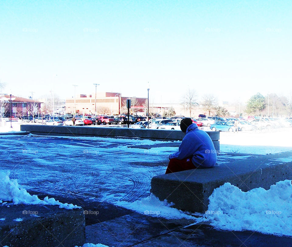 Sitting on a bench thinking.