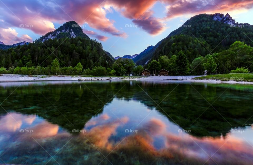 Reflection of alps mountain and lake at sunset twilight 