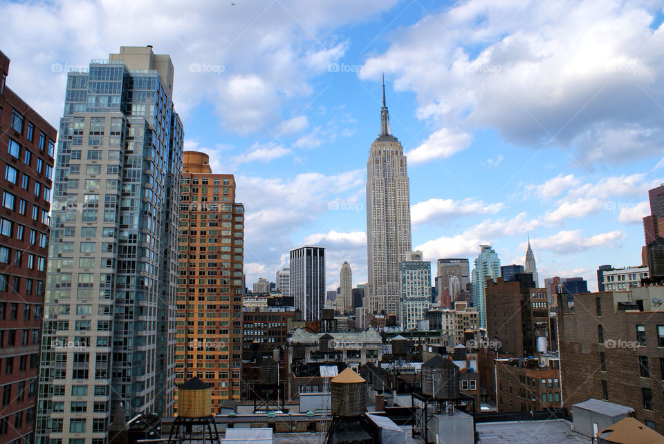 water tanks empire state building. new york. skyline view. blue skies. by snutten