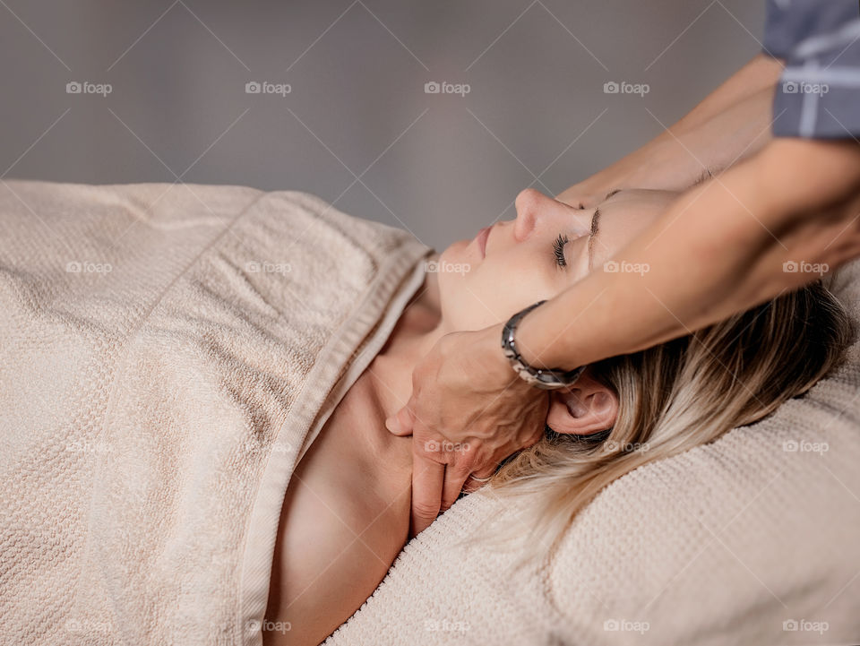 a woman is getting massage