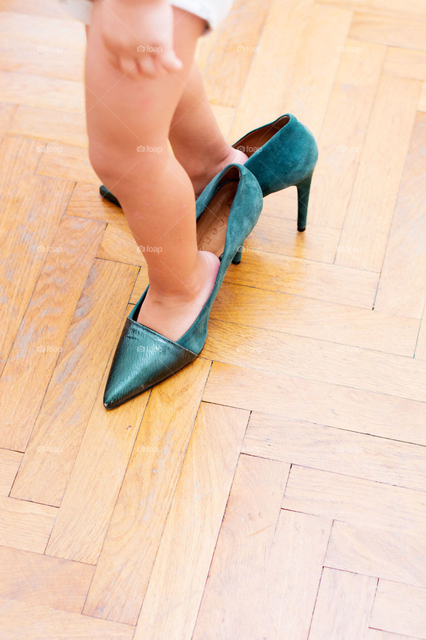 baby in heels. baby wearing mom's high heels