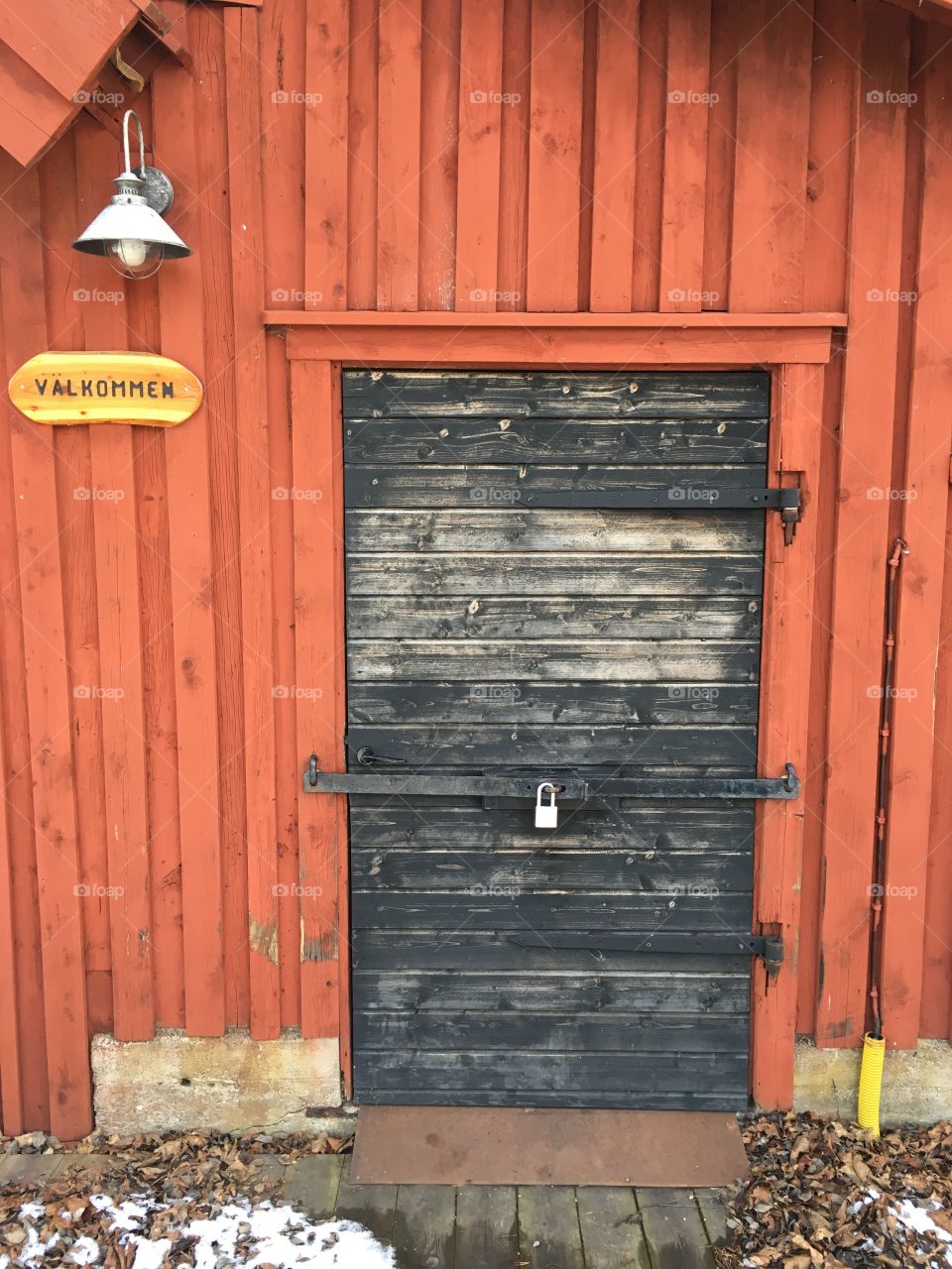 Wooden closed door with a padlock, Kolmarden, Sweden