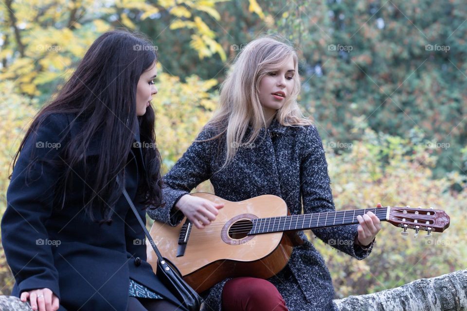 girl playing guitar