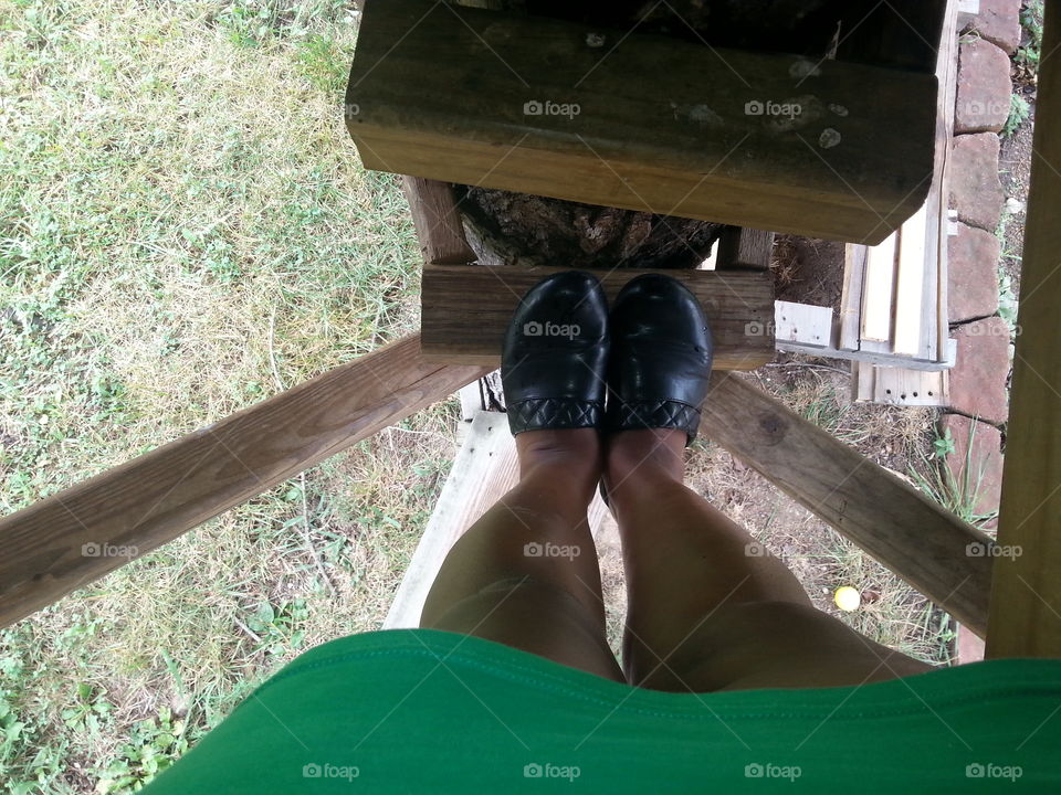 on the treehouse step