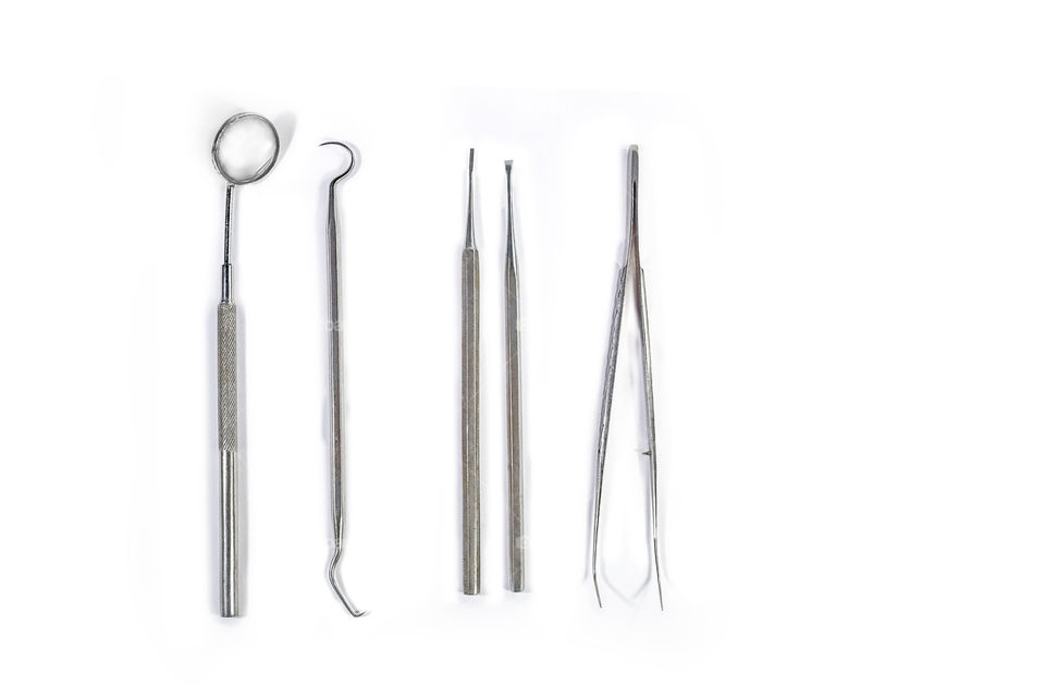 Medical Dental instruments mirror etc on the white background isolated and arranged in row.