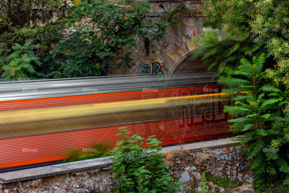 Train is leaving the tunnel in Athens, Greece.