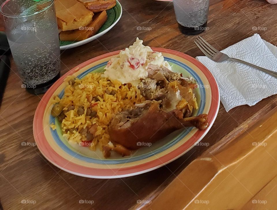 arroz con gandules, pollo asado y ensalada de papas.(rice with pigeon beans, baked chicken,  and potato salad)