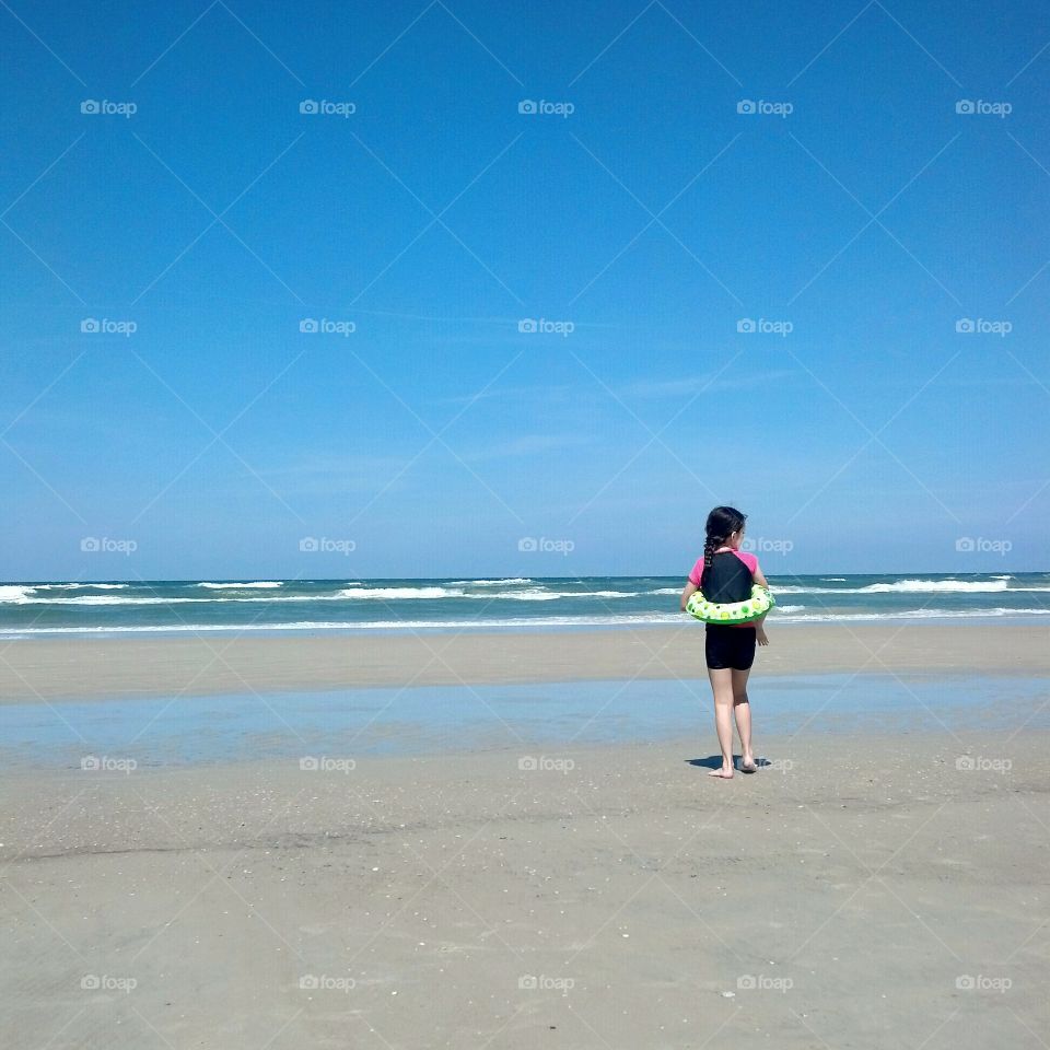 Girl Walking On Beach