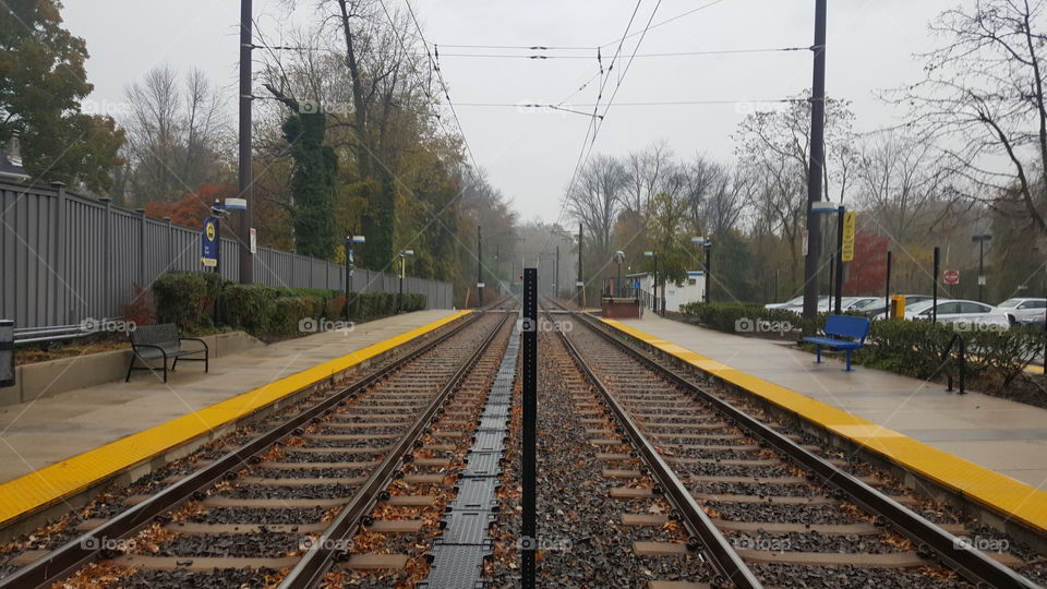 Waiting for the train in the rain