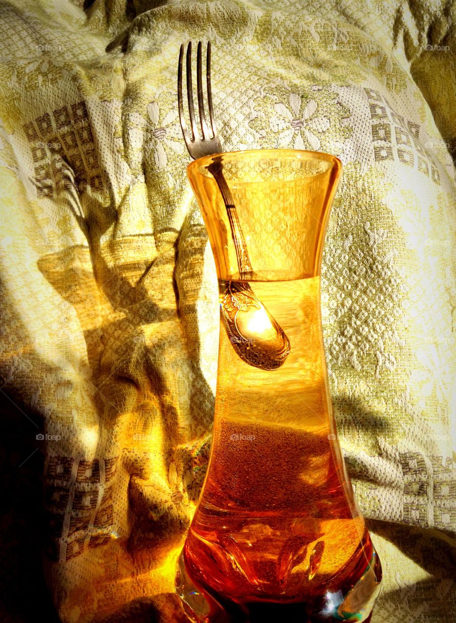 An old luxury unusual fork. She is no longer interested in ordinary food. She is attracted to everything unexpected, romantic and beautiful! π