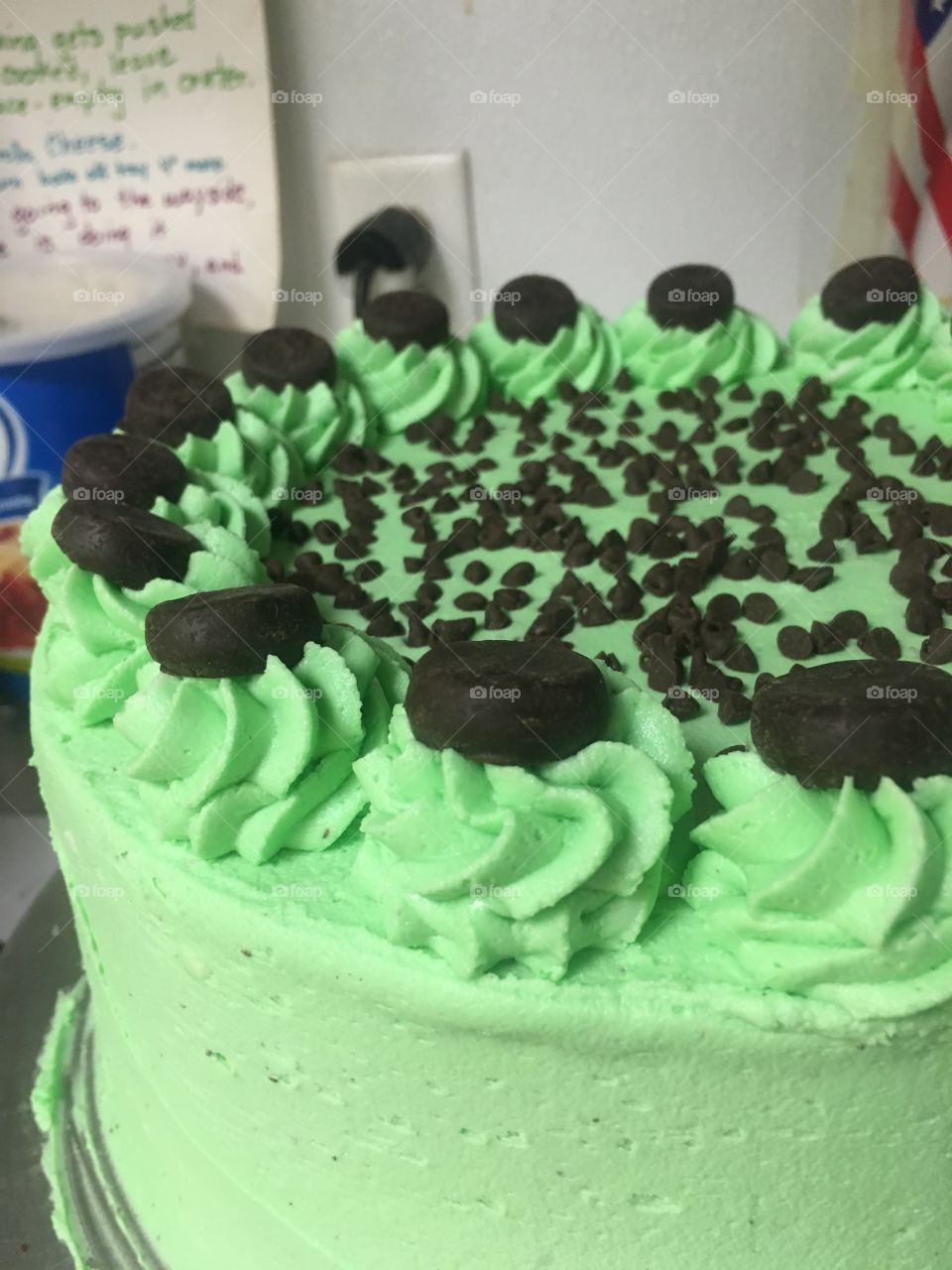 Mint chocolate cake! Chocolate cake, mint frosting, topped with York peppermint patties and mini chocolate chips