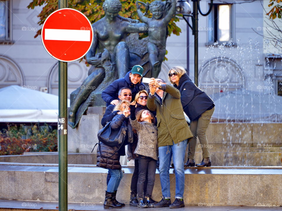 family selfie near the fountain