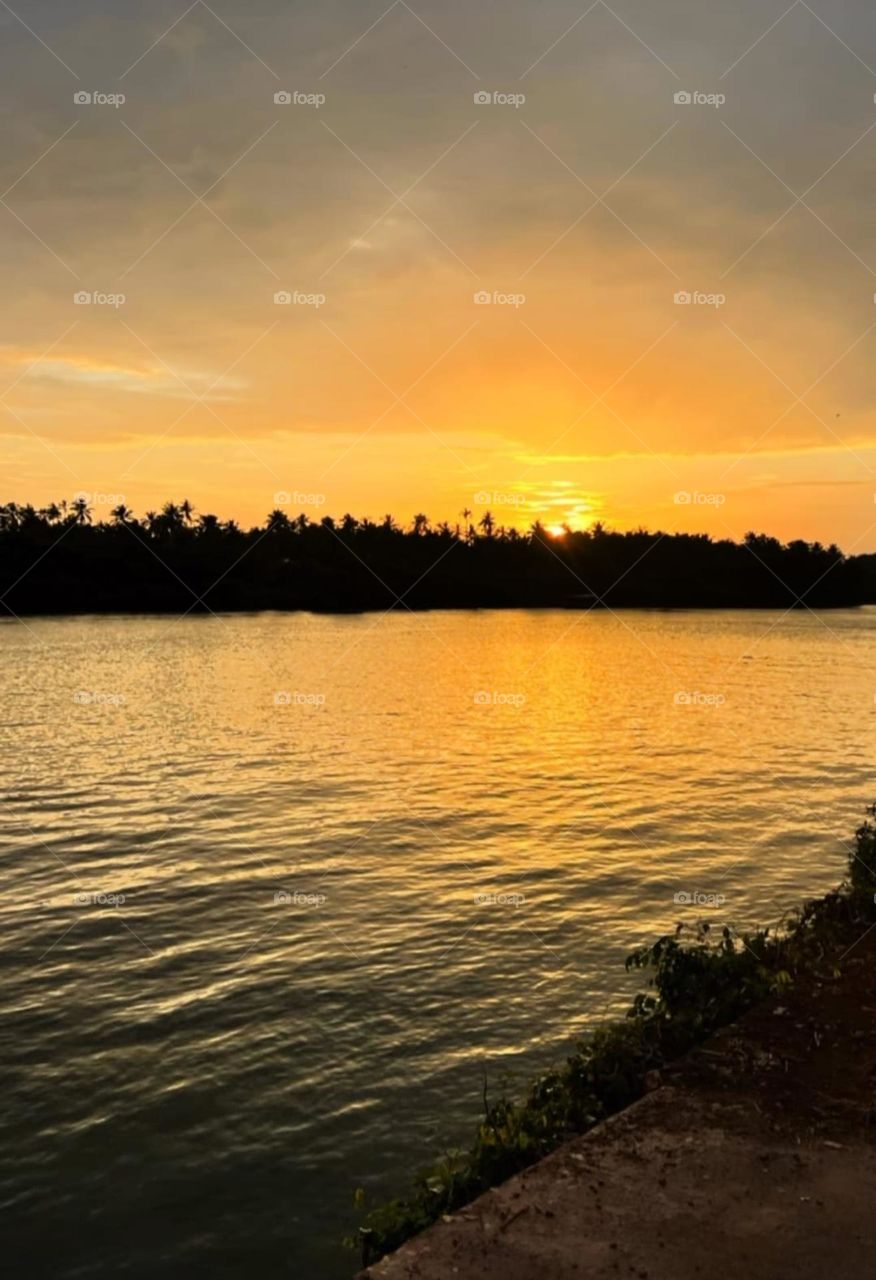 view of the river at the time of sunset in kerala