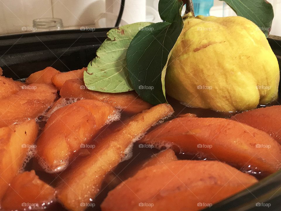 Home canning cooking quince fruit in both raw state and cooked state