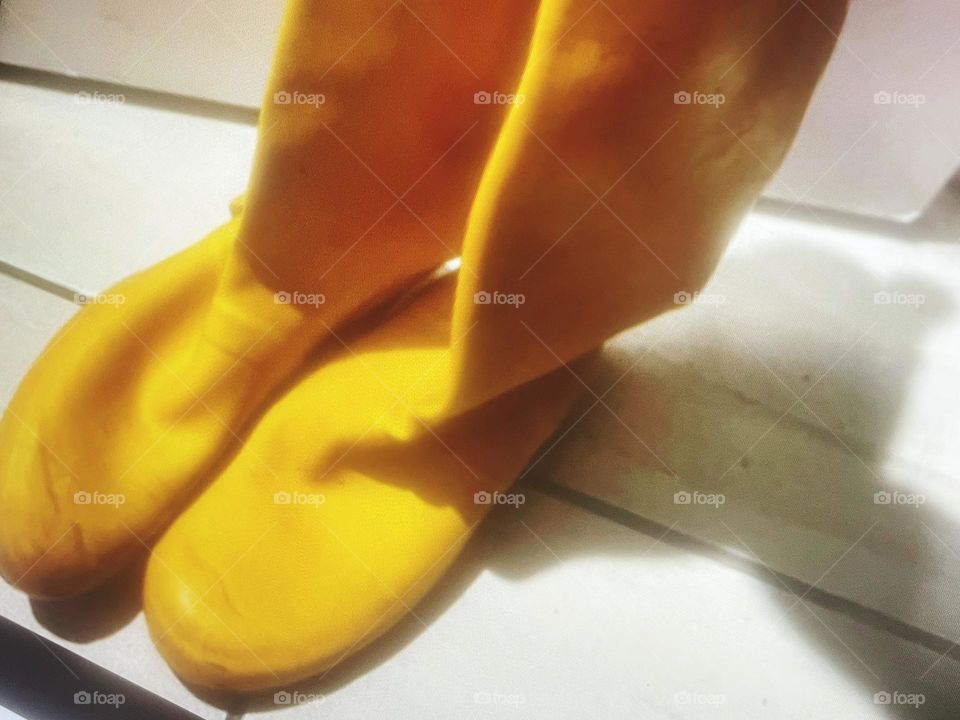 Photograph of bright yellow rain boots 