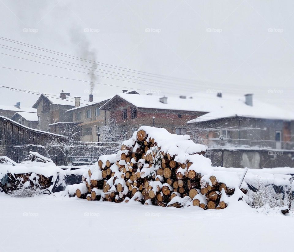 Smoking chimney and the white winter