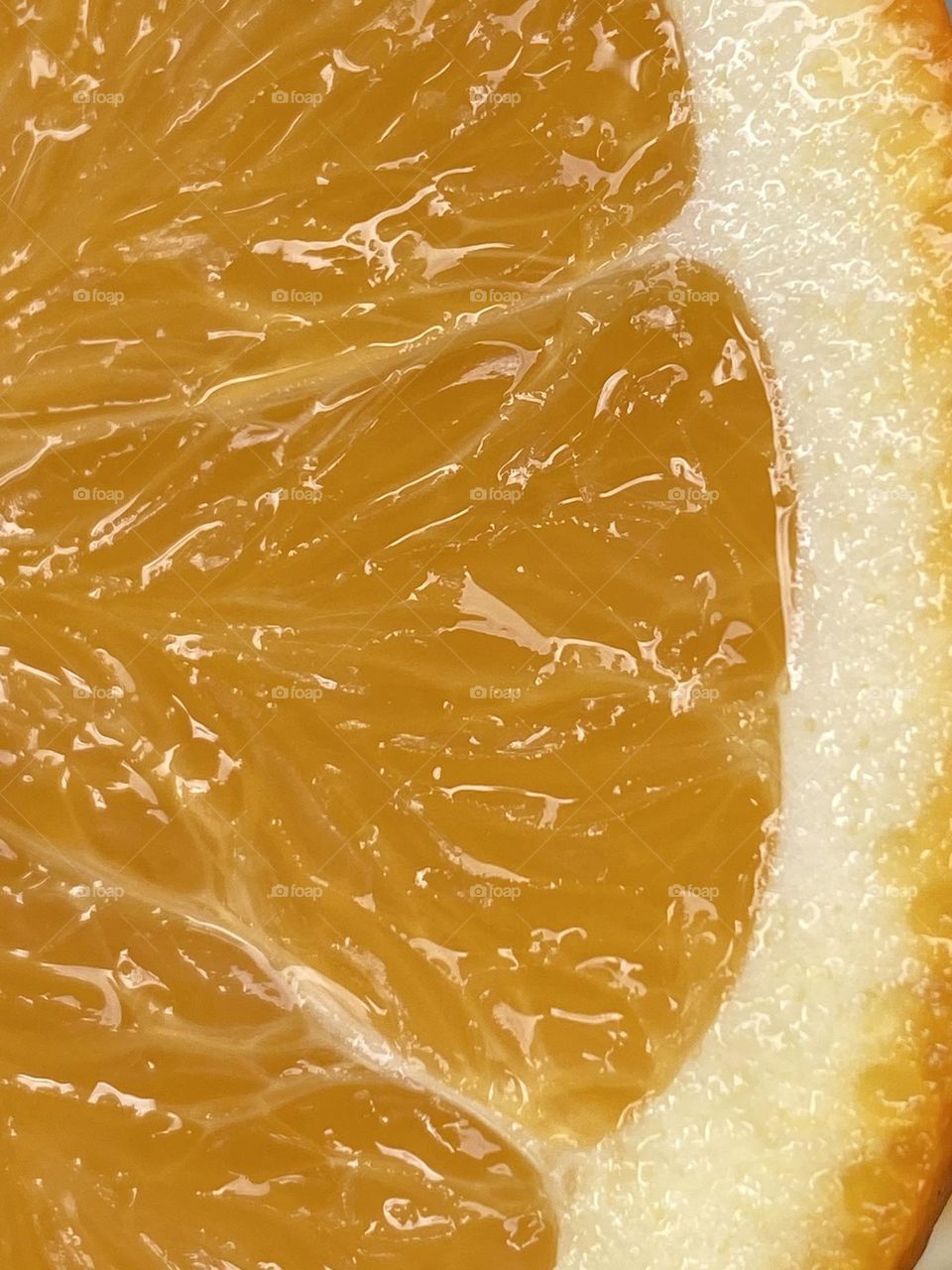 A close up on a slice of an orange fruit 
