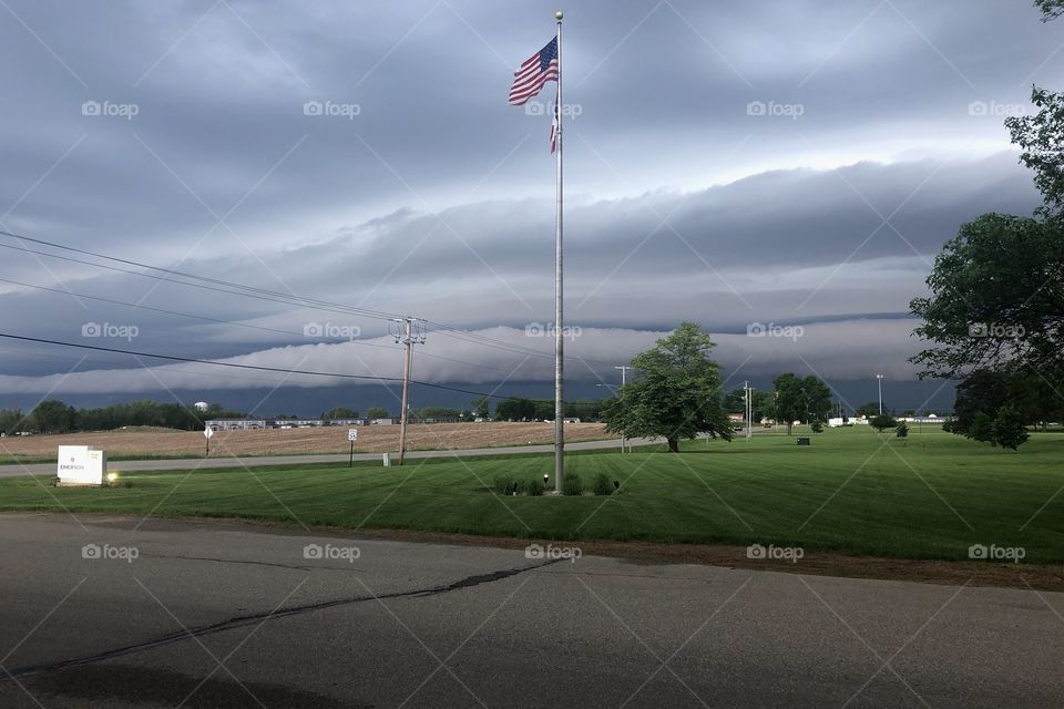 Large severe storm front moving in over the Midwest. The American flag in the center provides a sense of safety and comfort