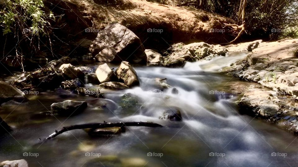 River at sunset on a hike motion blurred water. 